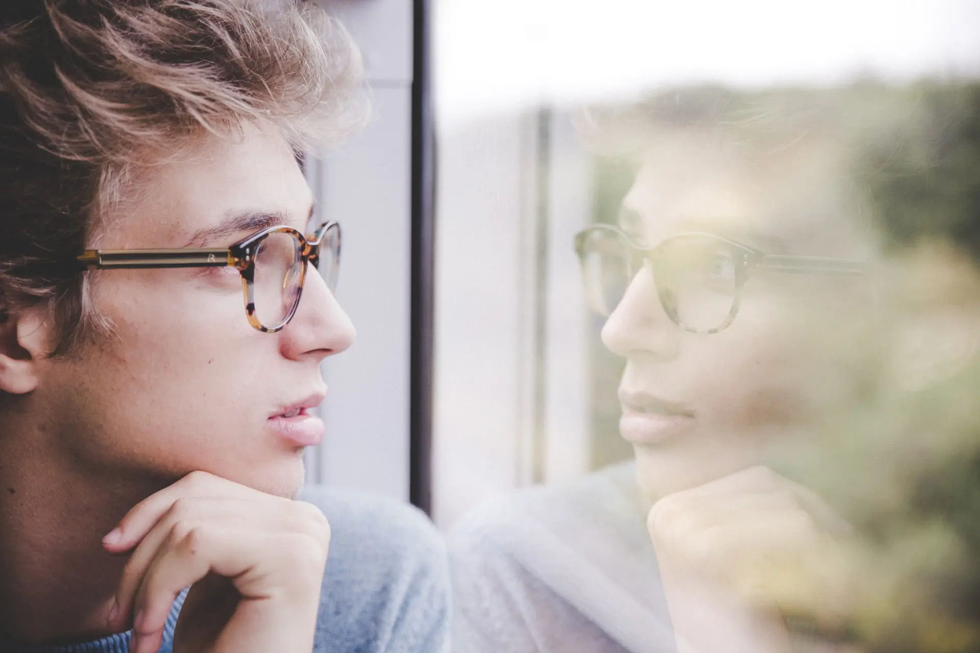 Someone looking at a reflection of himself